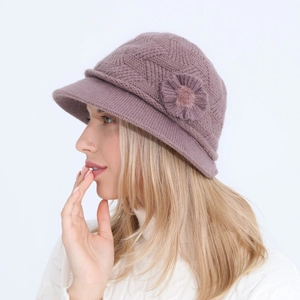 Detail of knitted winter hat for women in lotus purple featuring 3D floral accent