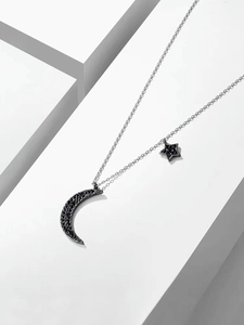 Elegant star and crescent moon necklace in silver finish with black pavé crystals