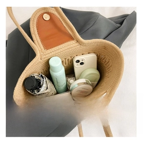 Detail presentation of the large woven tote bag interior showing spacious capacity