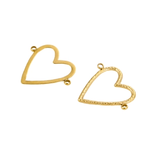 Detailed view of smooth and hammered gold heart connectors for DIY jewelry making