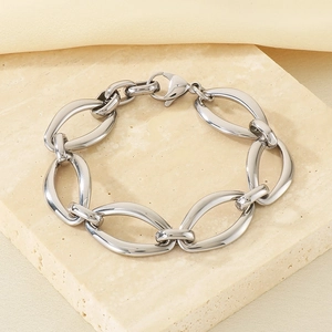 Macro detail of silver stainless steel thick link chain bracelet with lobster clasp