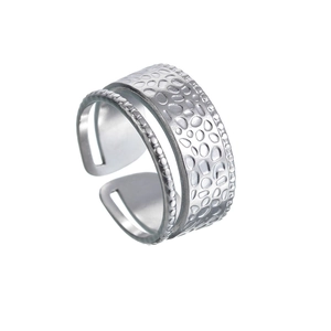 Detail of silver adjustable titanium ring featuring double layers and hammered texture