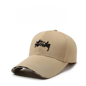Close-up of beige cotton baseball cap with Aimike embroidery and SPORT brim detailing