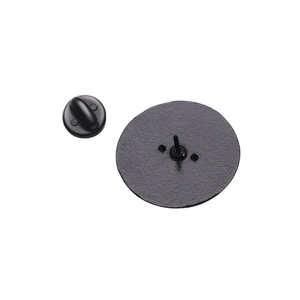 Detailed view of matte black metal badge base with needle pin and rubber clutch