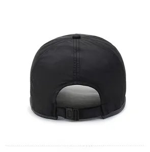 Detailed back view of black baseball cap showing adjustable plastic buckle strap
