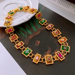 Vintage gold necklace with colorful enamel inlays and sparkling crystal accents