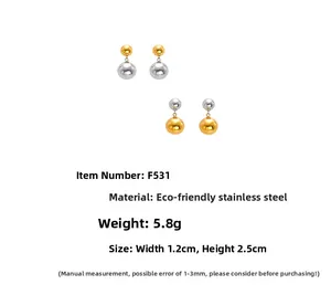 Detail of two-tone stainless steel ball earrings showing 1.2cm width and 2.5cm height