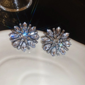 Macro shot of silver crystal flower earrings with marquise cut stones and starlight effect