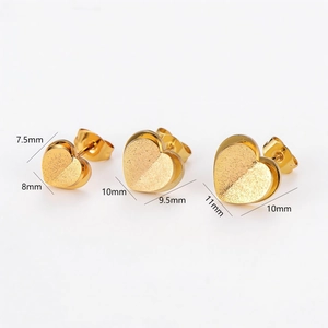 Three pairs of matte gold double-layered heart stud earrings in various sizes