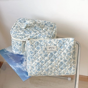 Blue floral quilted makeup bag set with top handle and flat pouch for daily storage