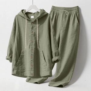 Detail view of sage green linen hoody set showing fabric texture and button design