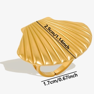 Detailed macro view of gold shell ring showing 2.9cm width and radial textures