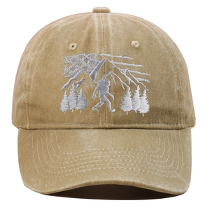 Close-up of Bigfoot embroidery with American flag and forest on khaki washed cotton cap