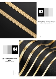 Detailed macro view of flat gold-plated snake chain necklaces with polished metal texture