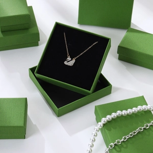 Rose gold swan pendant necklace with crystals and avocado green jewelry gift boxes