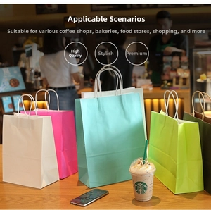 Close-up of colorful daisy kraft gift bags with white rope handles on a wooden counter