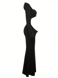 Detail of elegant black maternity dress featuring waist cut-out and backless fishtail design