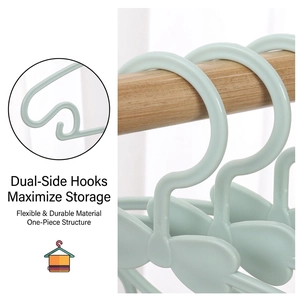 Mint green bow plastic hangers for baby clothes featuring anti-slip hooks for small straps