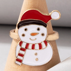 Macro view of Christmas snowman ring with red and white enamel on gold metal base
