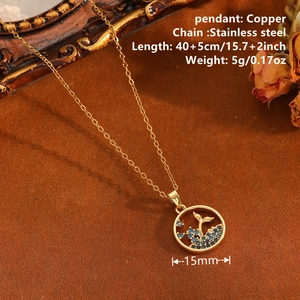 Gold hollow whale tail pendant necklace on stainless steel chain with blue gemstone