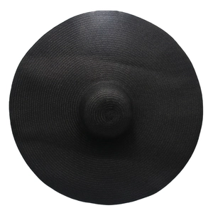 Macro view showing precise circular weaving detail of a 25cm wide brim black straw hat