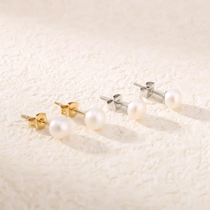 Minimalist stainless steel pearl stud earrings in gold and silver finish options