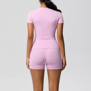 Rear view of lilac brushed yoga set showing slim fit short sleeve tee and compression shorts