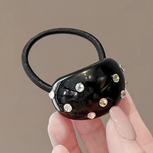 Élastique à cheveux noir avec ornement ovale en résine et strass scintillants
