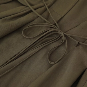 Olive green V-neck dress with pleated waist and adjustable bow tie detailing