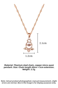 Detailed view of rose gold angel wing heart pendant with dancing zircon stone