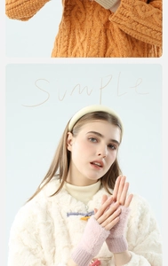 Detailed knit texture of orange fingerless gloves and model wearing pink plush winter mittens