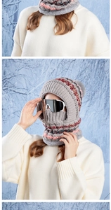 Detail of grey winter knit hat set showing thick fleece lining and colorful stripe pattern
