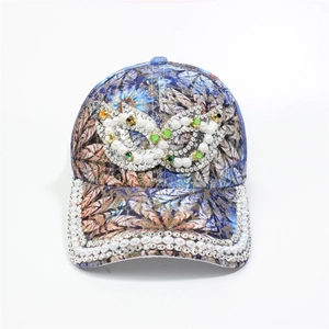 Detail of floral baseball cap with pearls and rhinestones on infinity logo and brim