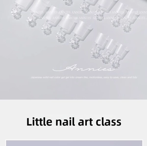 Close-up of matte thin crescent moon nail tips arranged in a neat rows on a light surface
