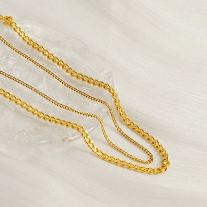 Layered gold stainless steel Cuban link necklaces for women in various chain thicknesses