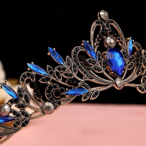 Macro shot of vintage baroque tiara with navy blue gemstones and black crystals