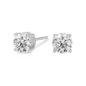 Macro detail of 925 sterling silver stud earrings with round cut zircon and four-prong setting