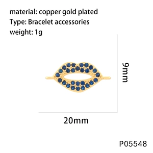 Detail of a 20mm lip-shaped gold-plated pendant with blue zircons for bracelets