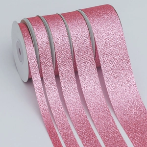Pink glitter polyester ribbons in five different widths for gift wrapping and decoration