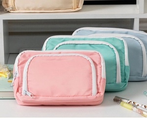 Three minimalist large-capacity pencil cases in pink, mint green and light blue colors
