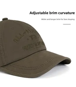 Detail of cotton baseball cap with embroidered lettering and foldable wide brim design