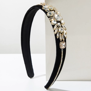 Elegant velvet headband with sparkling crystals and rhinestones on a white podium