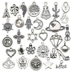 Collection of 28 assorted antique silver alloy charms for DIY jewelry and crafts