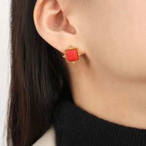 Vintage gold-framed red square stone titanium steel stud earrings shown on model