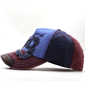 Detail of vintage washed baseball cap featuring York 3D embroidery and contrast stitching