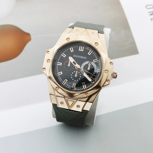 Men's fashion quartz watch with large rose gold case and silicone strap on display