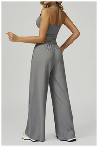 Side view of gray halter crop top and high waist wide leg yoga pants set for women