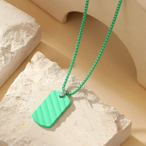 Detail of green rectangular wave texture pendant on beige stone slabs for a premium look