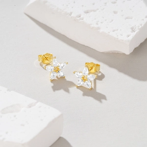 Detail shot of petal-shaped S925 sterling silver stud earrings with clear cubic zirconia