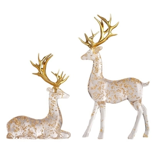 Modern gold foil elk statues in transparent resin with metallic golden antlers